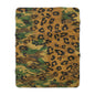 Sherpa Blanket Camo Leopard by Mariu del Campo — 50x60 size draped on sofa